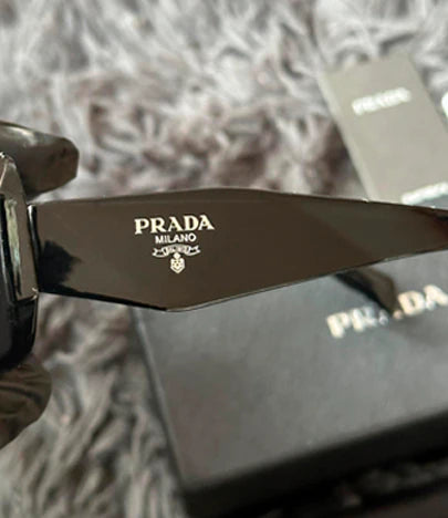 LENTES DE SOL PRADA
