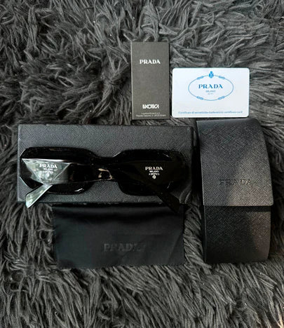 LENTES DE SOL PRADA